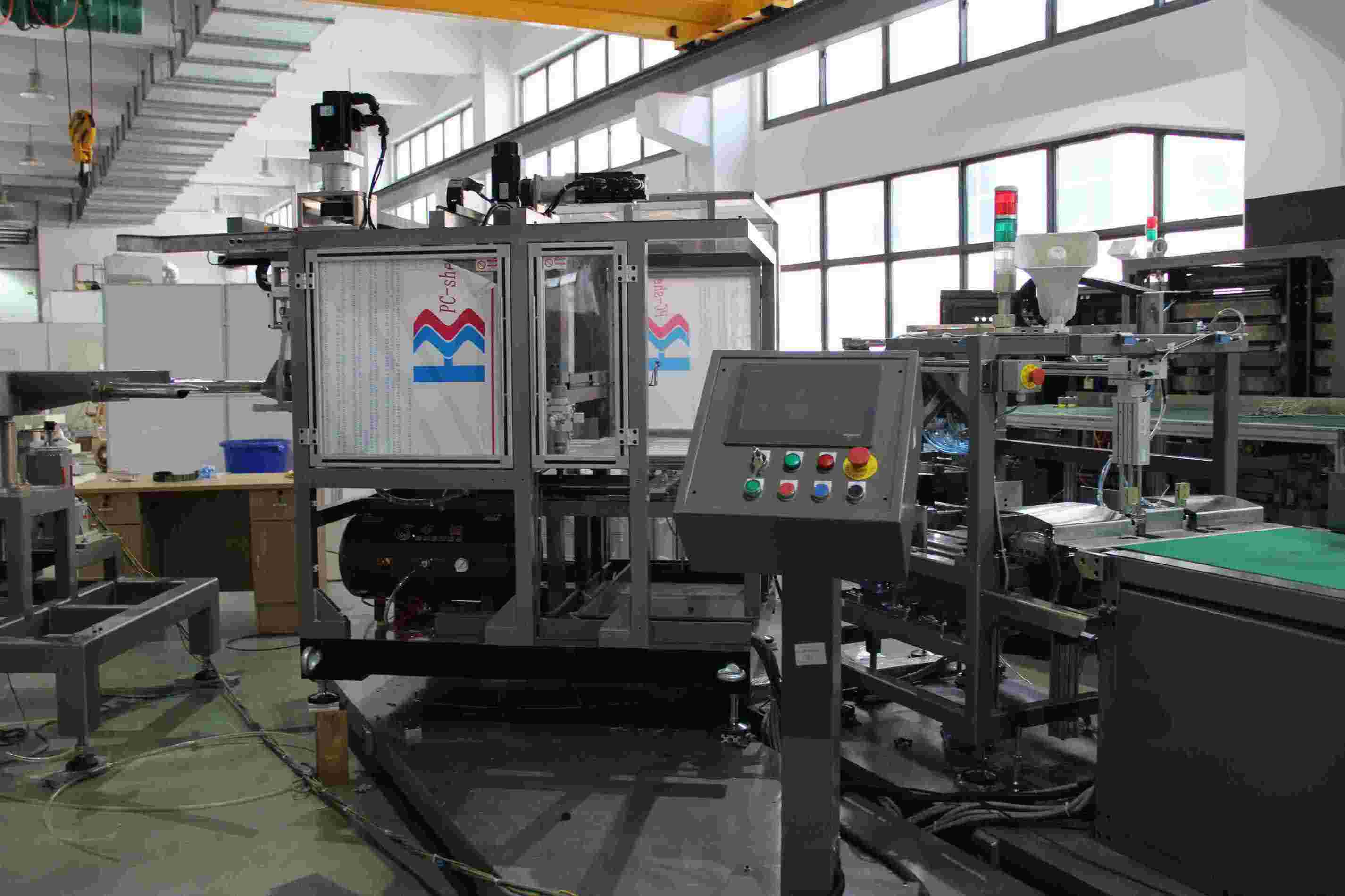 Automatic PP woven valve bag insertion machine Automatic PP woven valve bag insertion machine